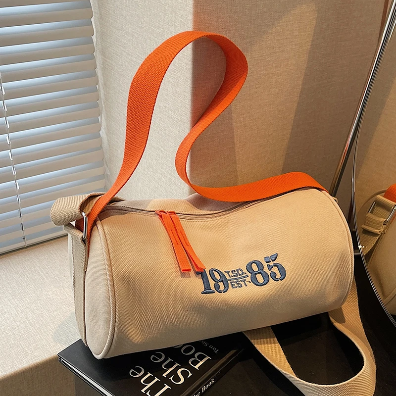 文艺刺绣帆布小包包女2025时尚新款潮圆筒包洋气百搭宽肩带斜挎包