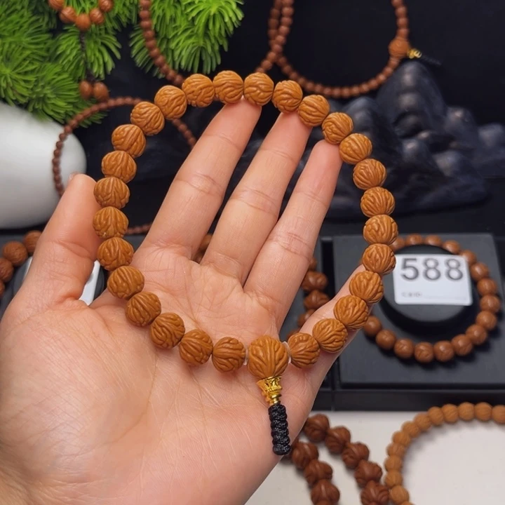 尚***哥桃核吊坠小金豆11