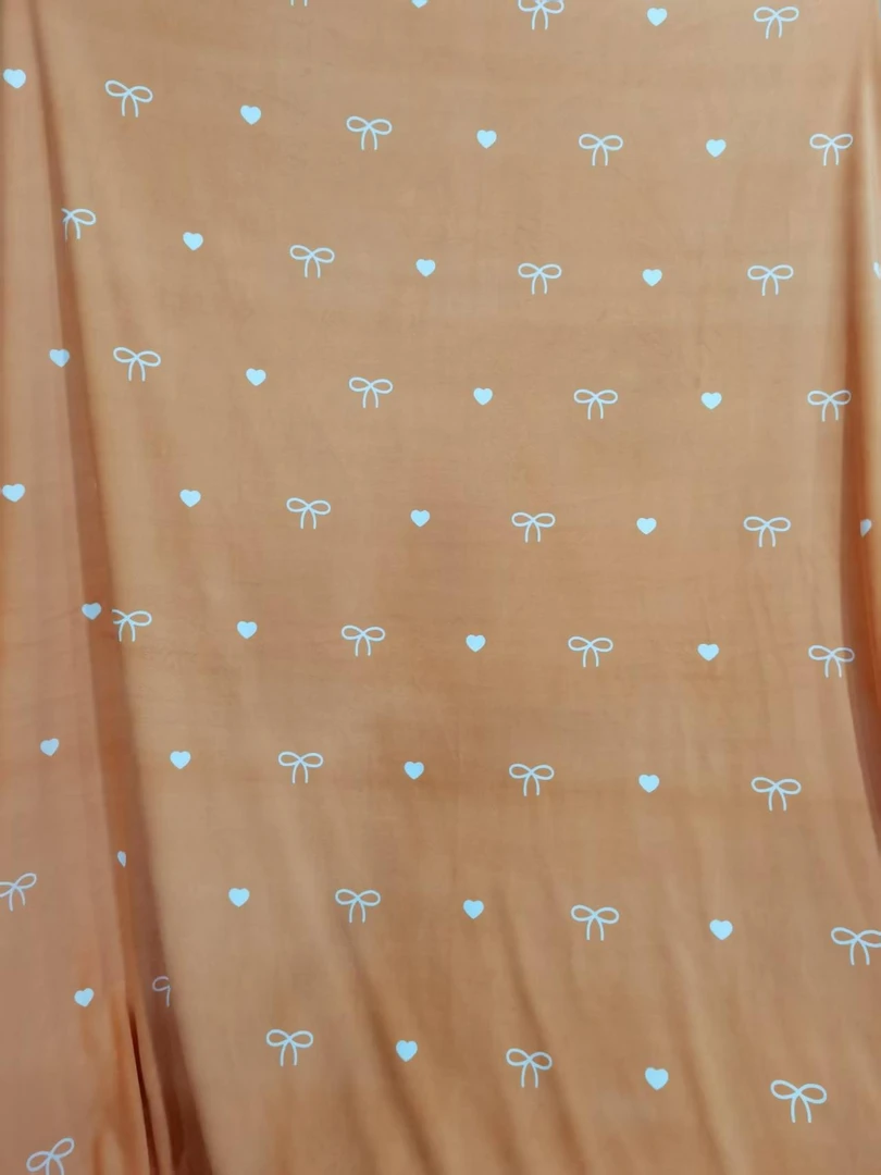 数码印花加密秋冬保暖绒布料~桔蝴蝶结