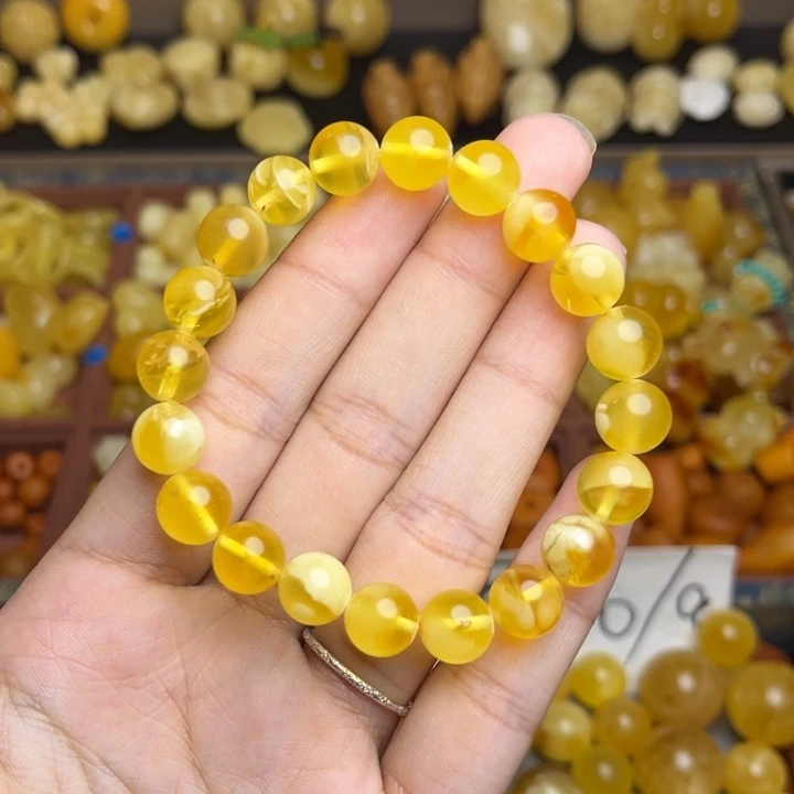 蜜蜡未镶嵌珠宝奇石金绞蜜妖花圆珠手串 微瑕卡10