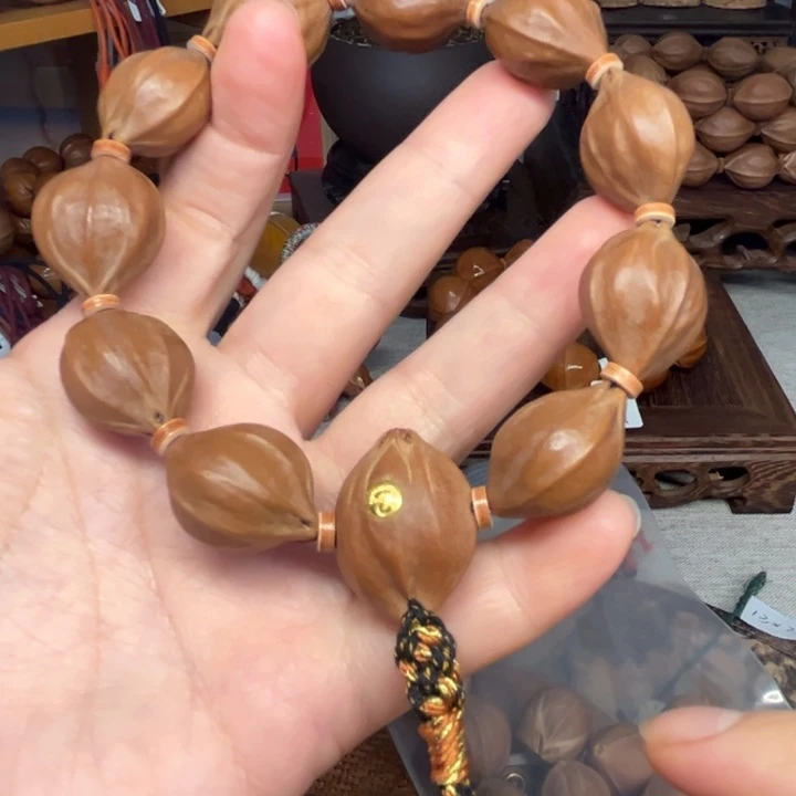 嘉***c橄榄核手串/手链梅林铁四花2.0*2.4