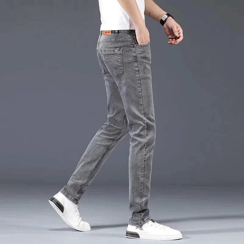 香港高端灰色牛仔裤男2025秋冬款修身小脚裤韩版百搭休闲弹力长裤