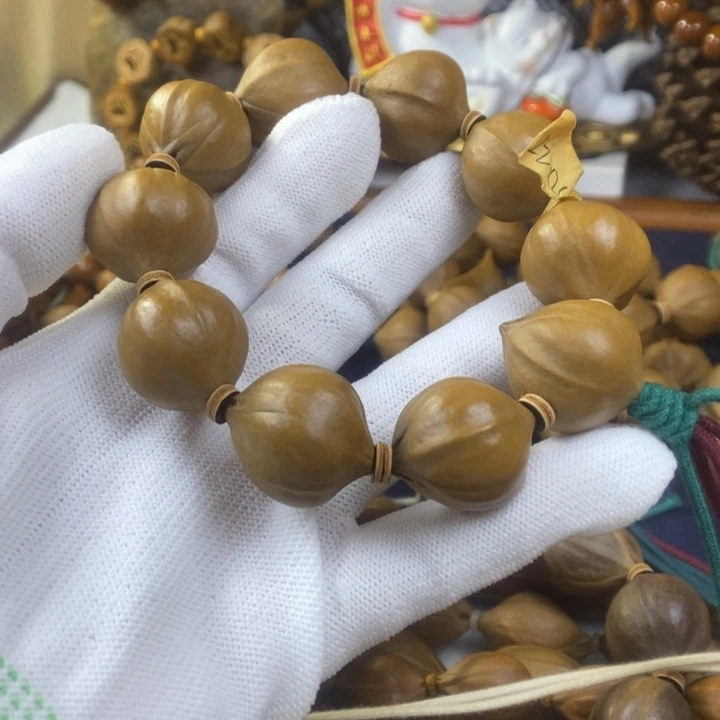 奥***星橄榄核手串/手链22-24三花