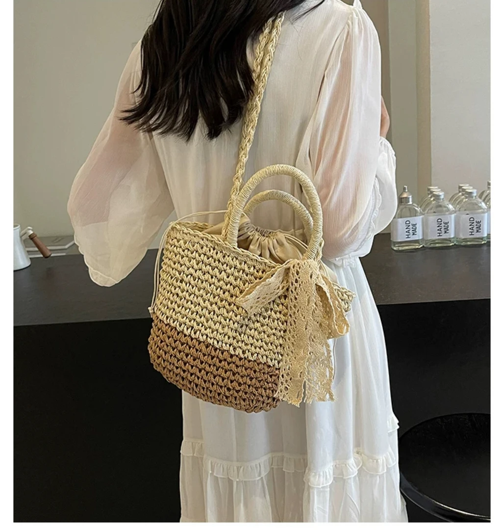 斜挎手提水桶包包女大容量2025新款夏天百搭编织草编包海边沙滩包