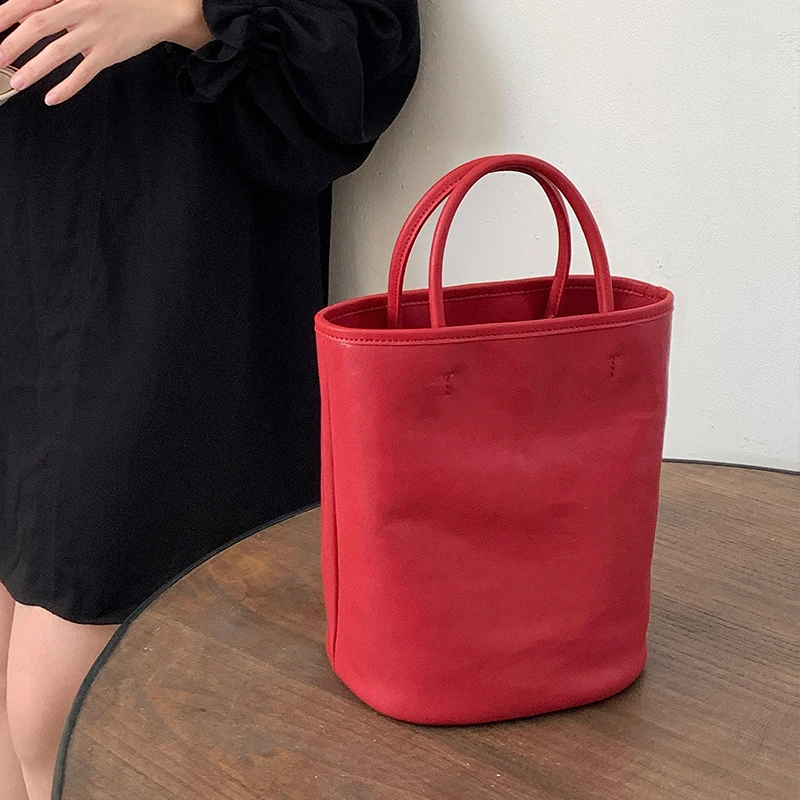 植鞣牛皮手提小水桶包2025新款小众单肩斜挎女包真皮手拎包女婚包