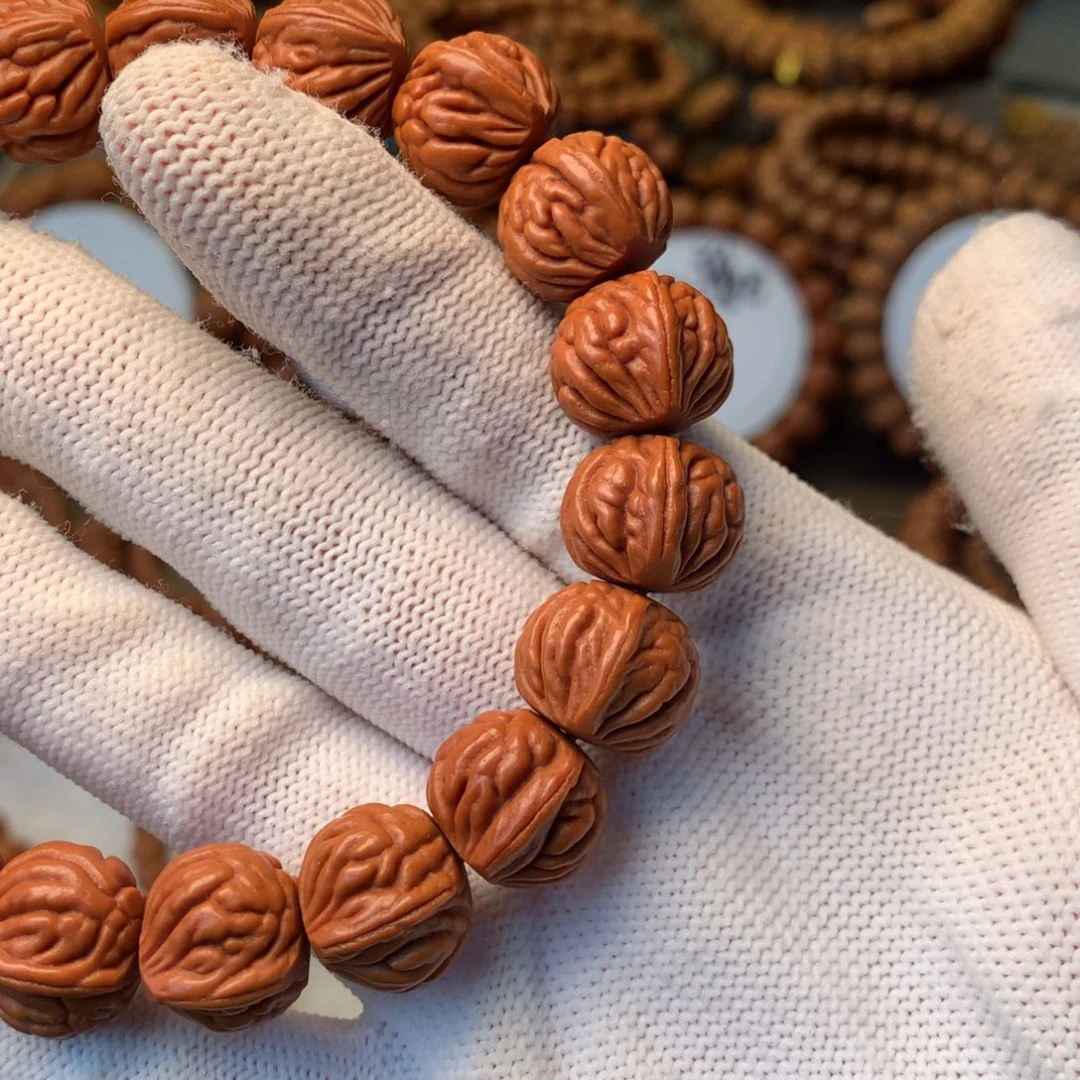 穆***及桃核手串秦岭龙纹