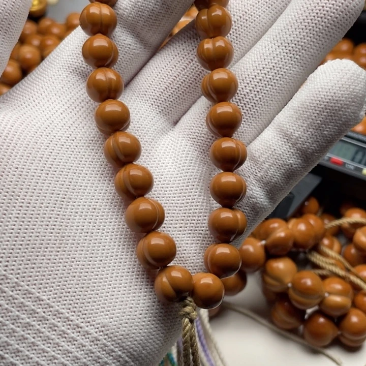 ***圁手串猴头核桃屁桃