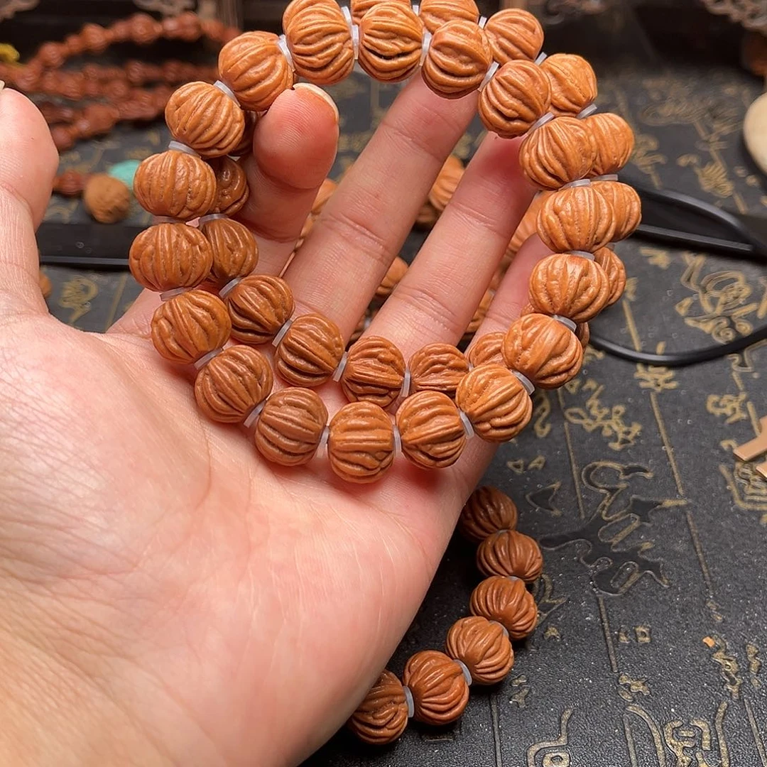 桃核吊坠佛手手串