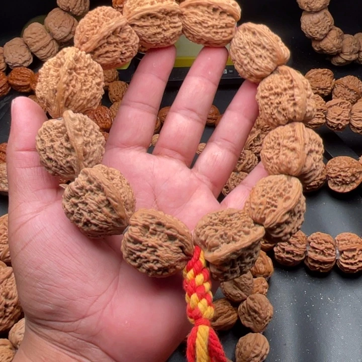 随***D桃核吊坠2南疆石手持