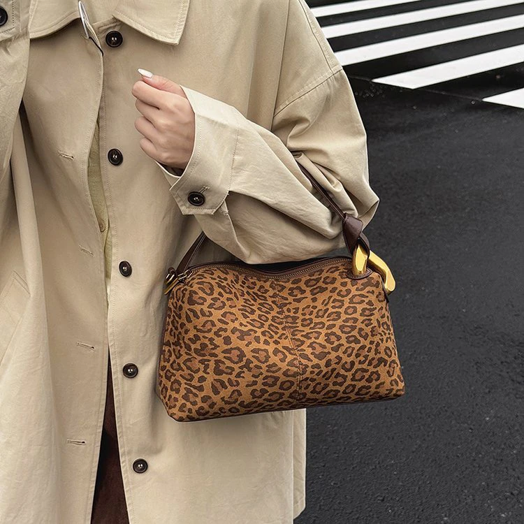 新疆包邮洋洋女包升级款大盘扣手提斜挎包【130250】