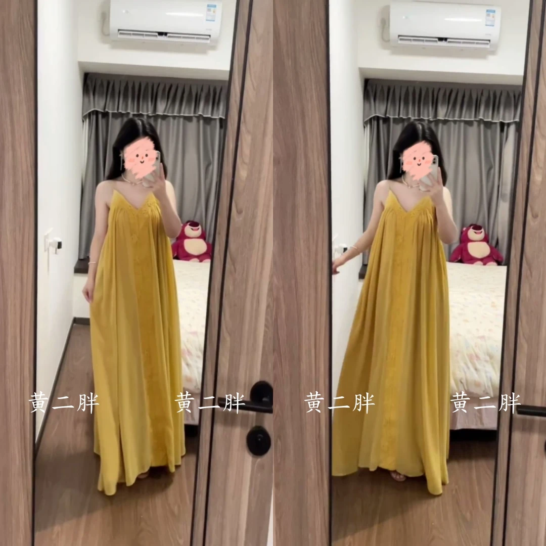 嫩黄色显白吊带连衣裙女宽松显瘦海边氛围感度假长裙2025夏季新款