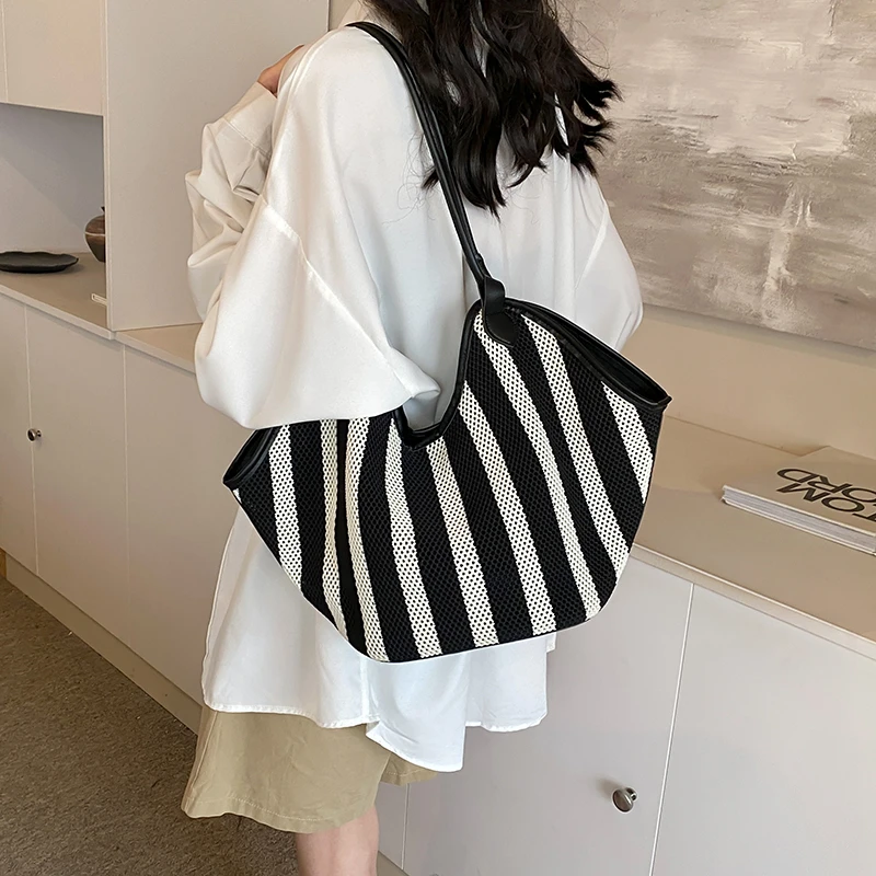 大容量编织条纹时尚夏季简约日韩单肩包休闲水桶包通勤大包包磁扣