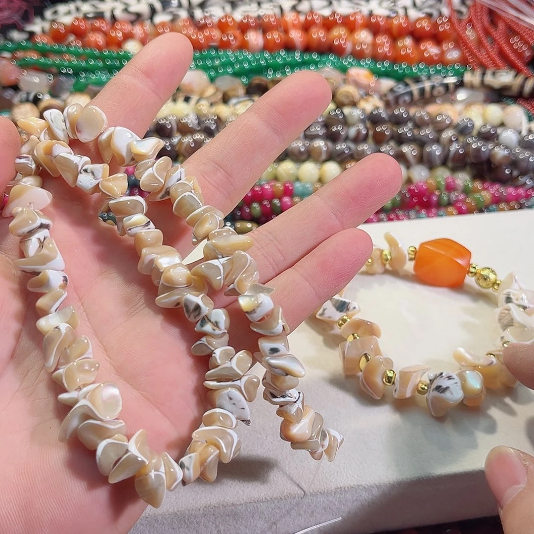 玛瑙/玉髓未镶嵌珠宝半成品花螺长牙一条