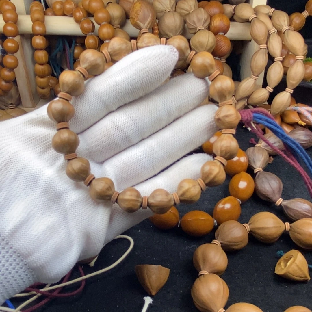 乌***天橄榄核吊坠1212三花蜜桃臀17颗