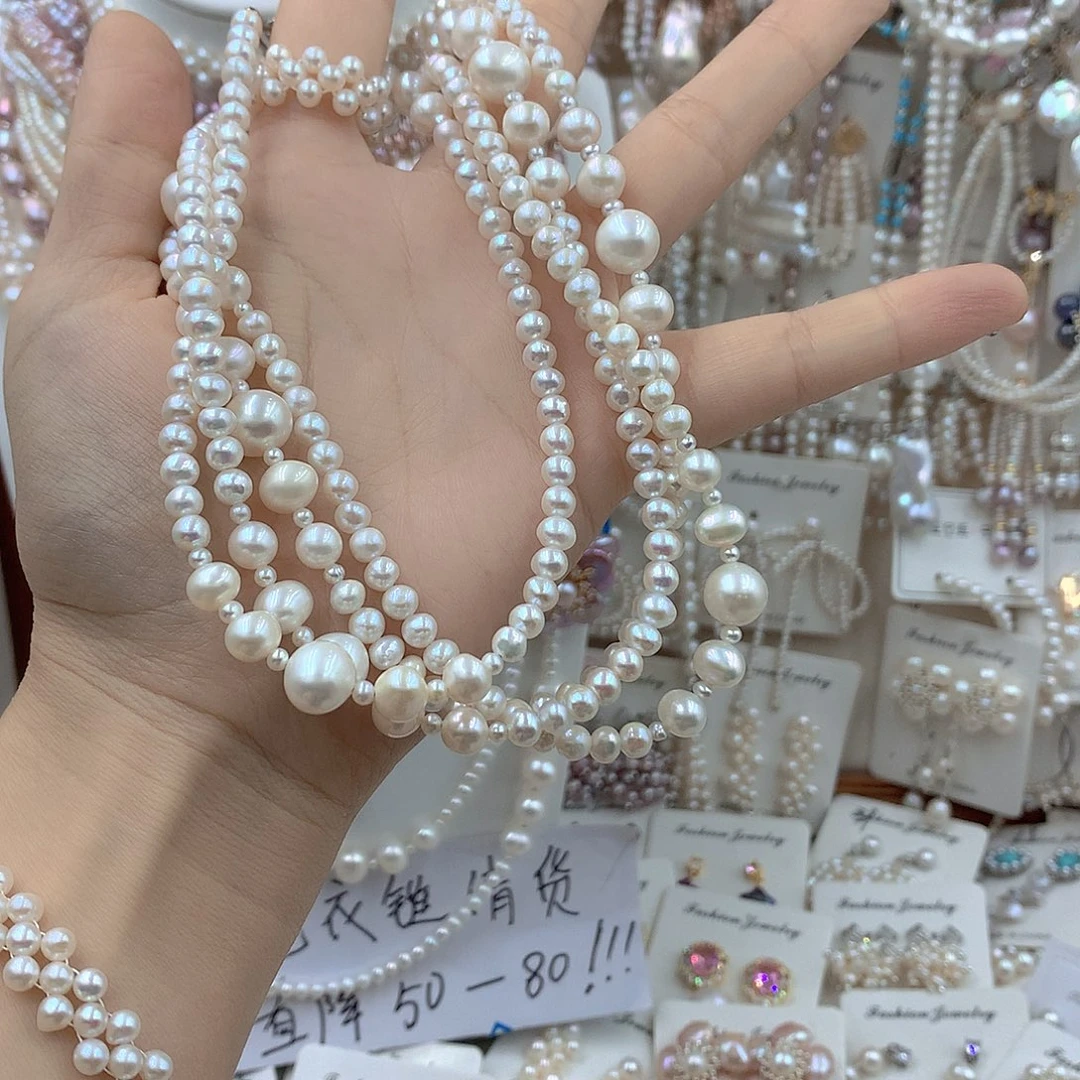 齐***糖银S925镶嵌淡水珍珠耳饰