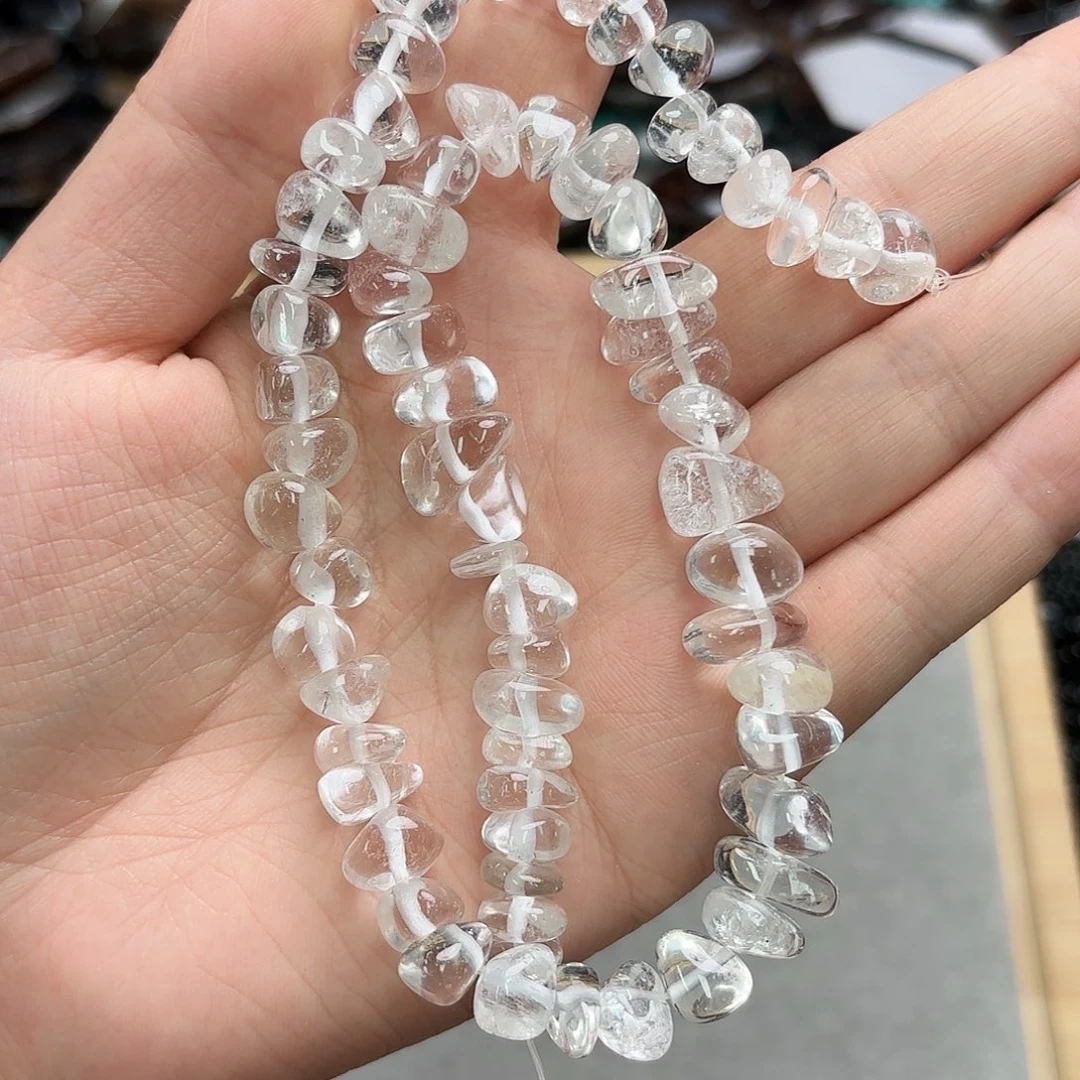 玛瑙/玉髓未镶嵌珠宝半成品白水晶中孔糖豆一条