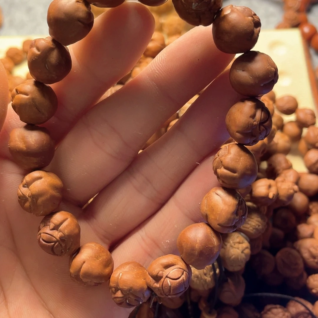 龙纹桃核雕刻猫爪（色差）