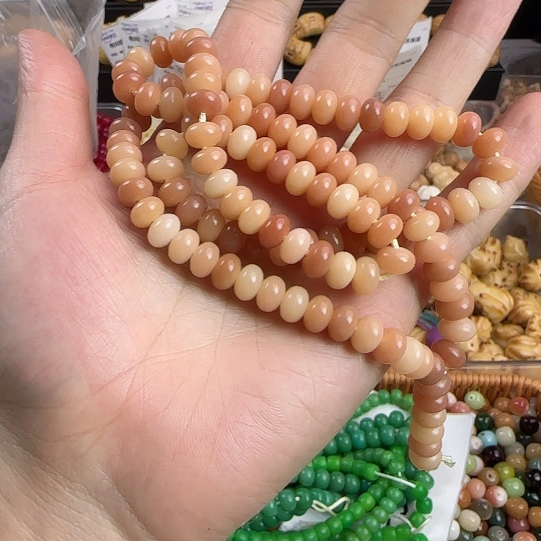 手串菩提根/象牙果粉色算盘一条