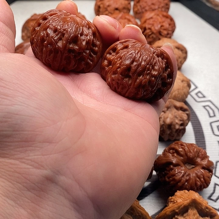 吉***心桃核吊坠磨盘文玩手把件