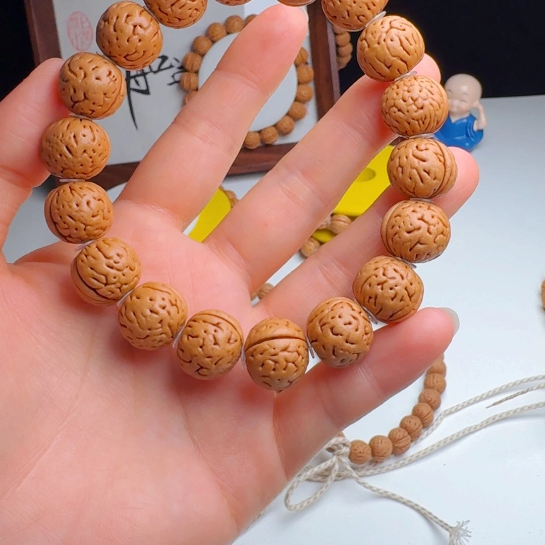 潇***3桃核手串15一字脐肌肉手串