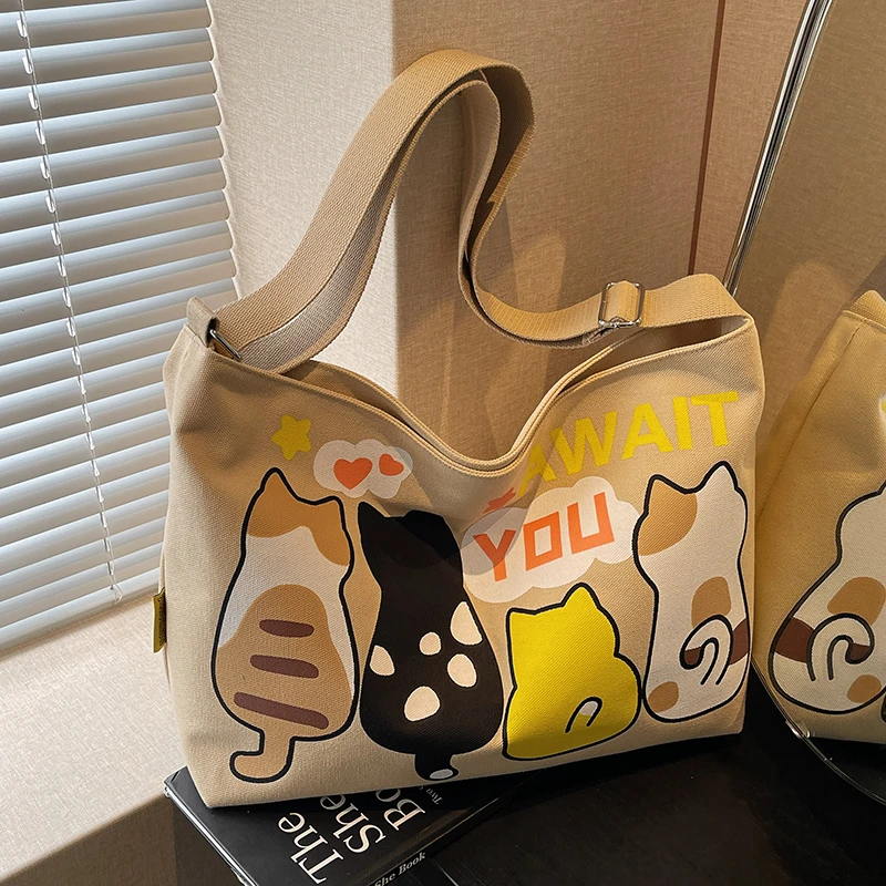 可爱卡通大容量帆布包包女休闲百搭单肩包学生上课通勤斜挎托特包