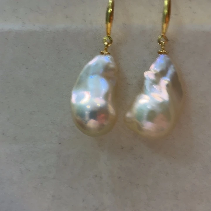 橘***兮淡水珍珠银S925镶嵌耳饰