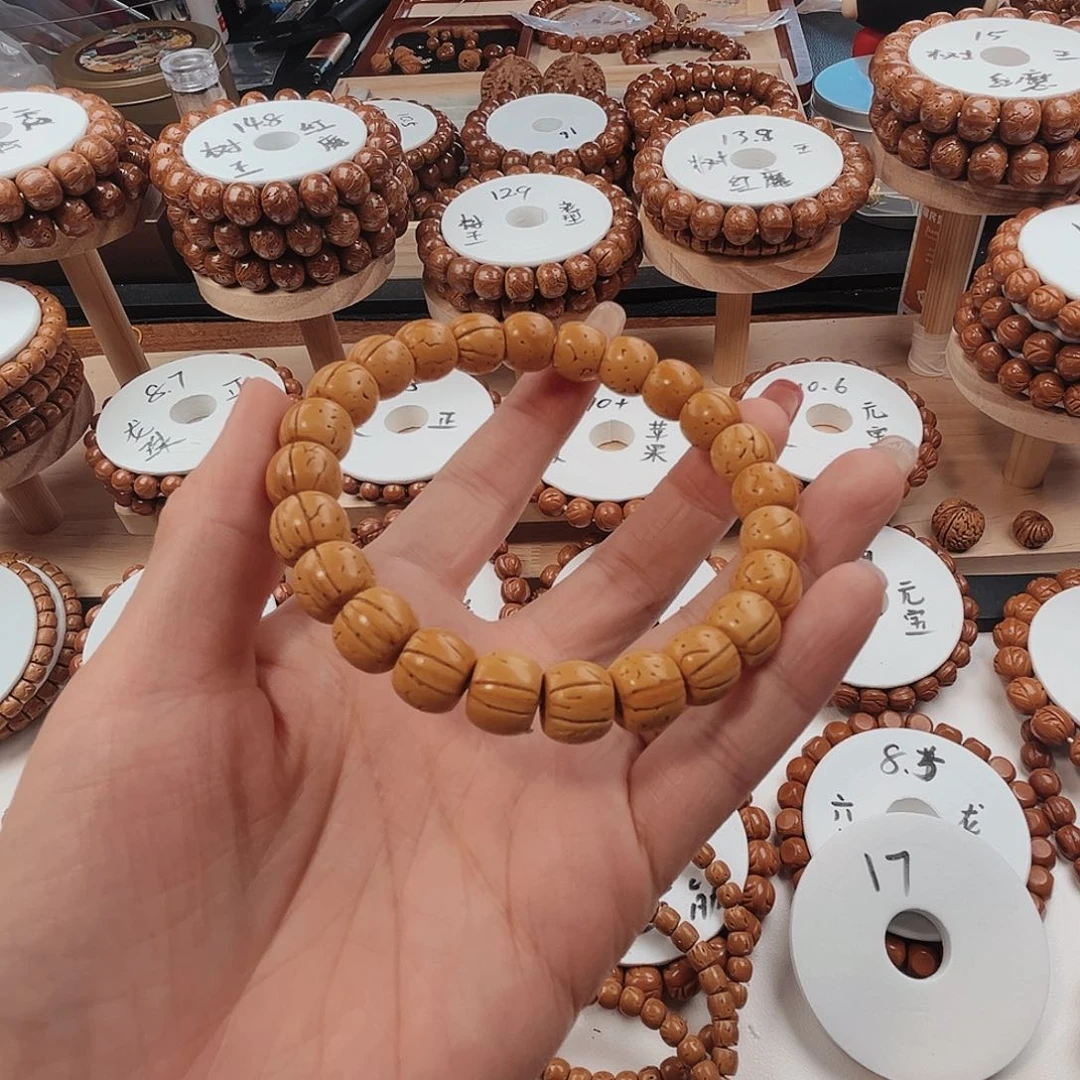 桃核手串阿*：桃核光珠
