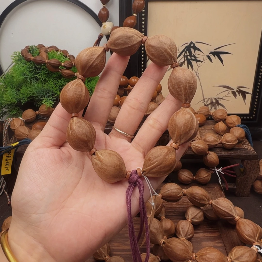 张***子手串橄榄核21.28梅林铁核