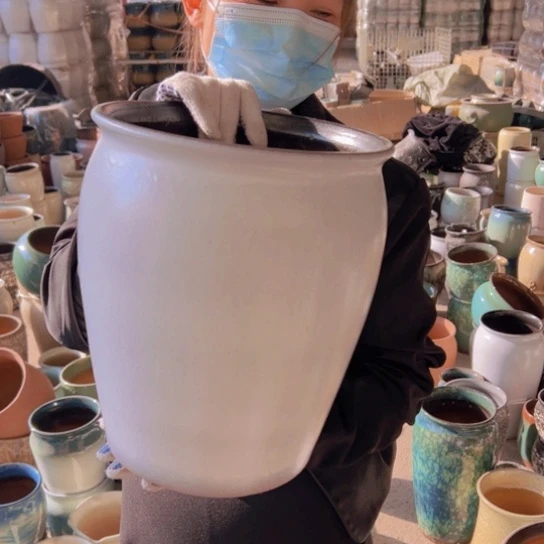 紫砂花盆高35口25。