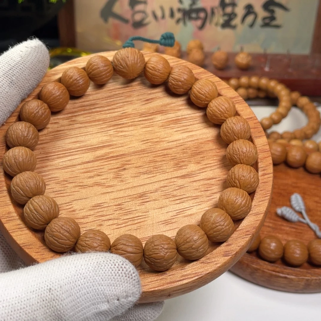 与***争猴头核桃手串凤羽