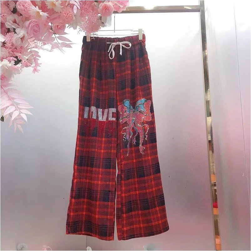A301欧美风设计师2024冬季新款重工烫钻字母蝴蝶格子直筒休闲裤女