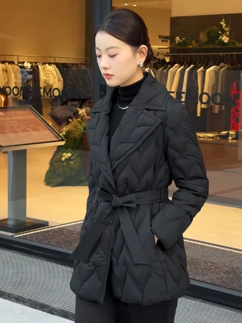 韩版黑色中长款棉服女2025冬季新款翻领收腰系带菱格高级感外套