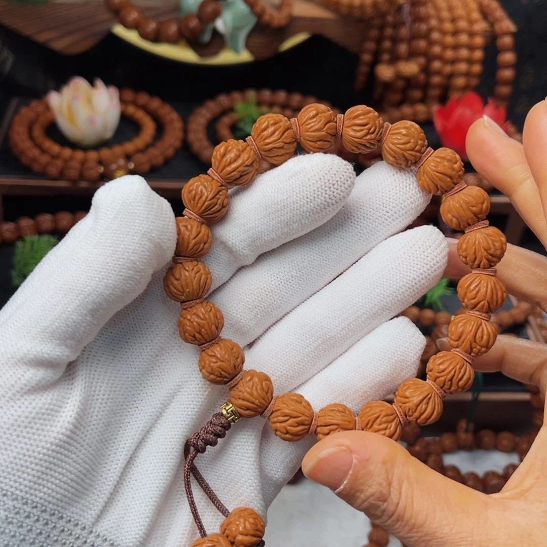 吊坠桃核13小金豆手持