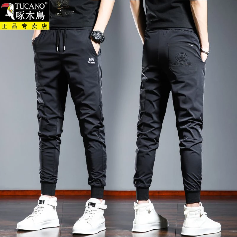 啄木鸟夏季薄款冰丝休闲裤男束脚长裤黑色刺绣高端百搭弹力潮流男