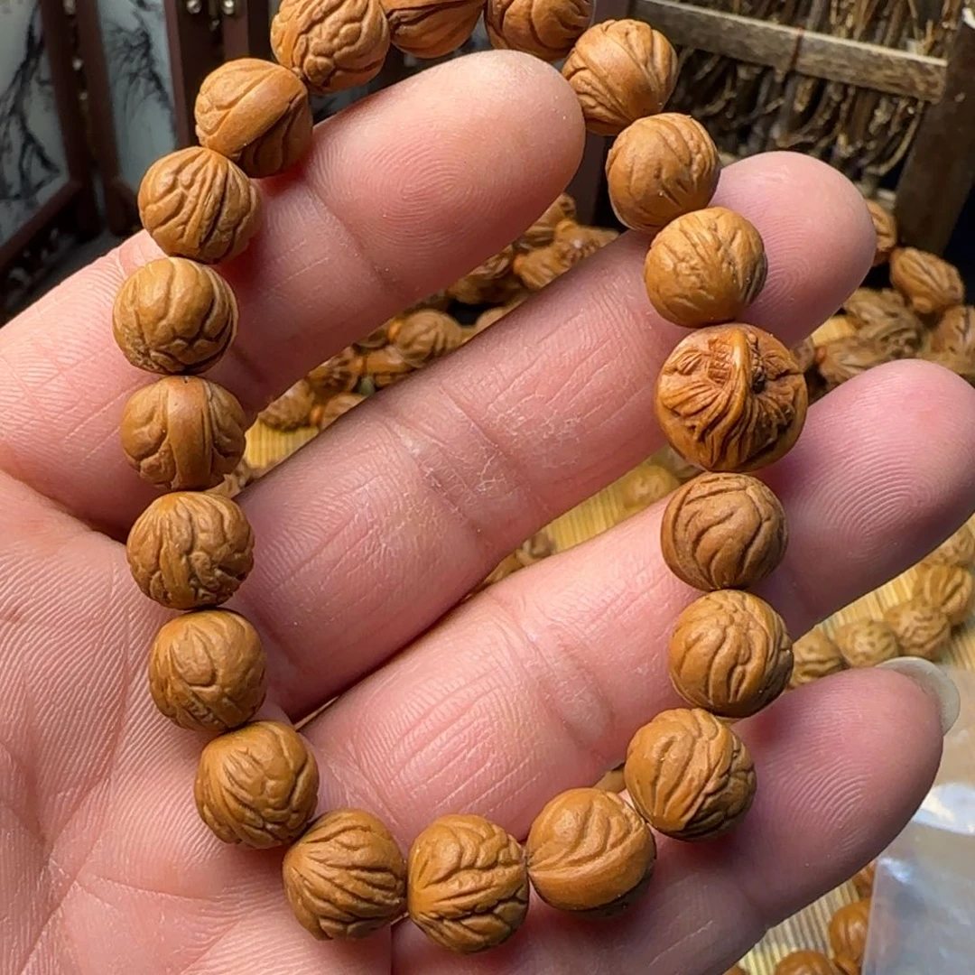 龙纹桃核玉龙脊手串配一颗纯手工福鱼单籽