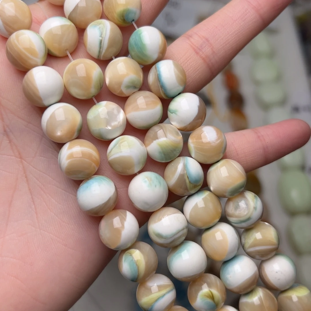 玛瑙/玉髓合金珠宝半成品K685。11.5mm天然夜光螺圆珠一条/拍二