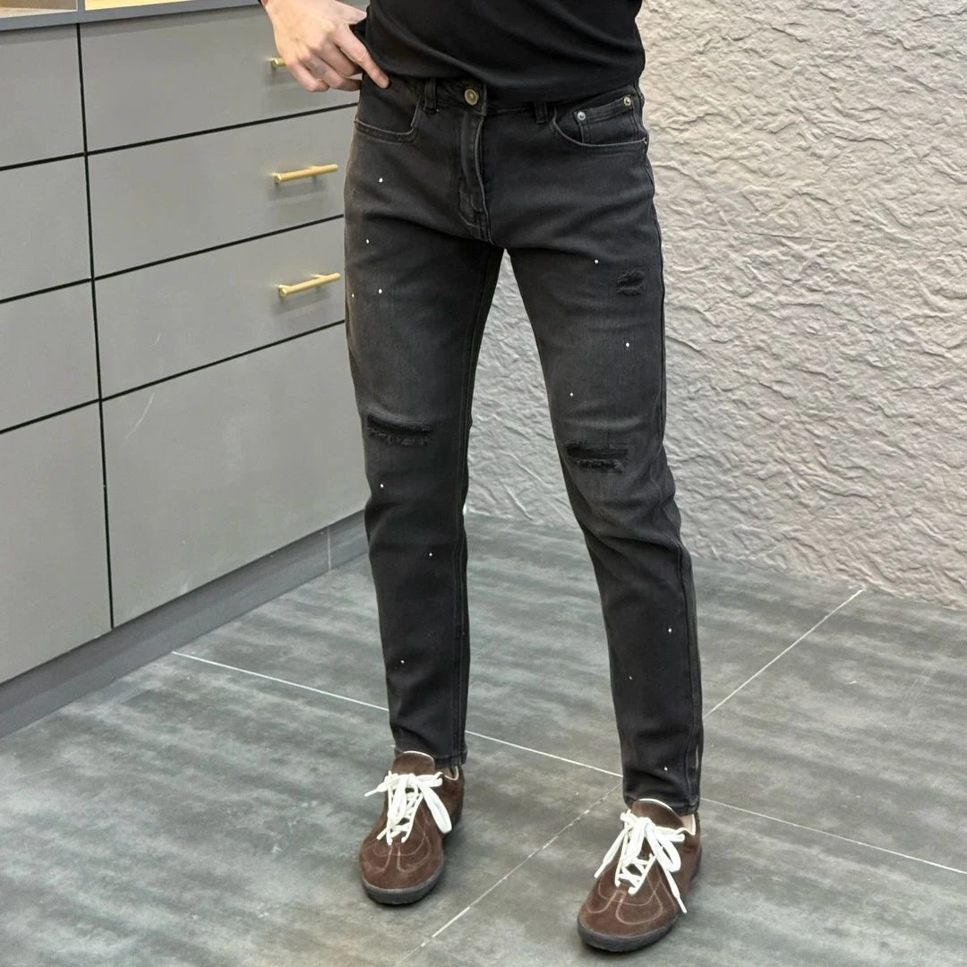 黑色破洞牛仔裤男潮牌泼墨漆点设计款新款时尚修身小脚裤