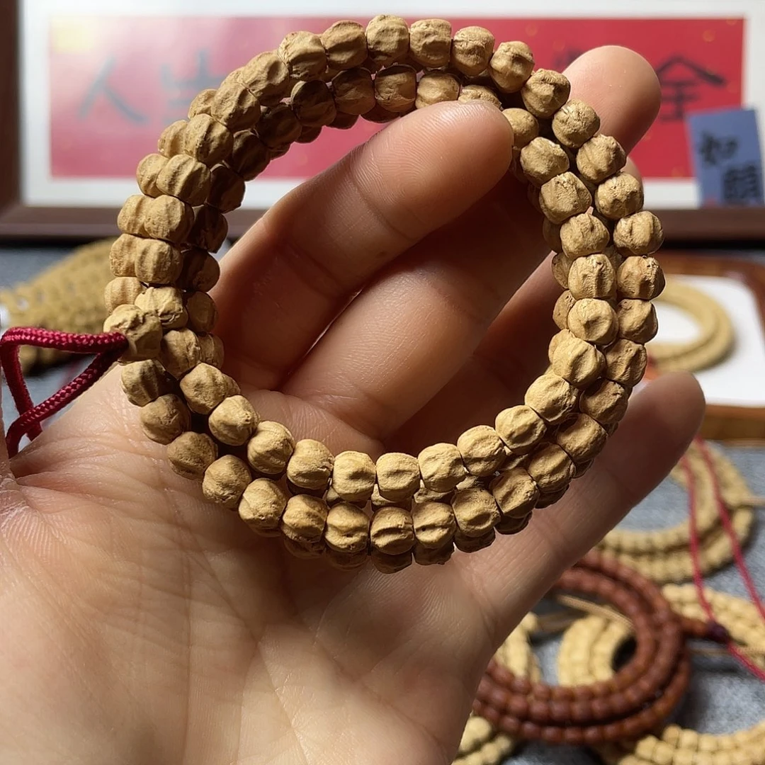 柏香籽/百香籽吊坠红皮微磨莲花龙脊7mm