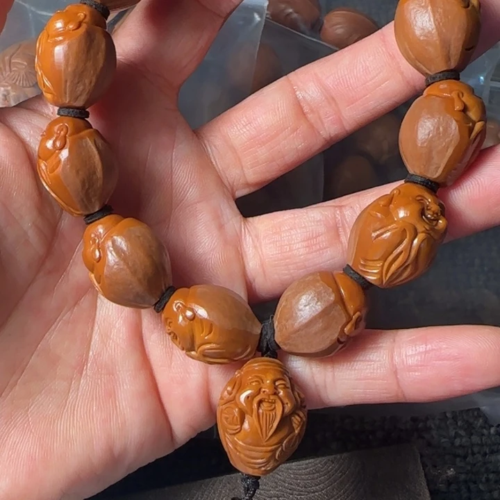 z***e橄榄核吊坠包衣财迷