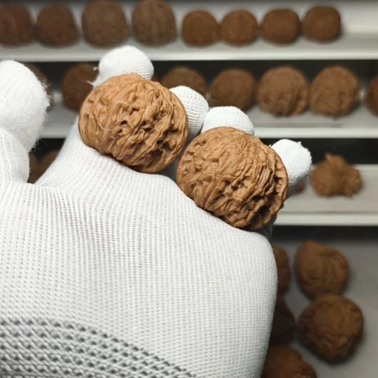 胡***卜文玩核桃吊坠山地磨盘