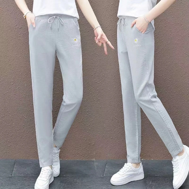 女士夏季小雏菊刺绣冰丝绉小西裤1153