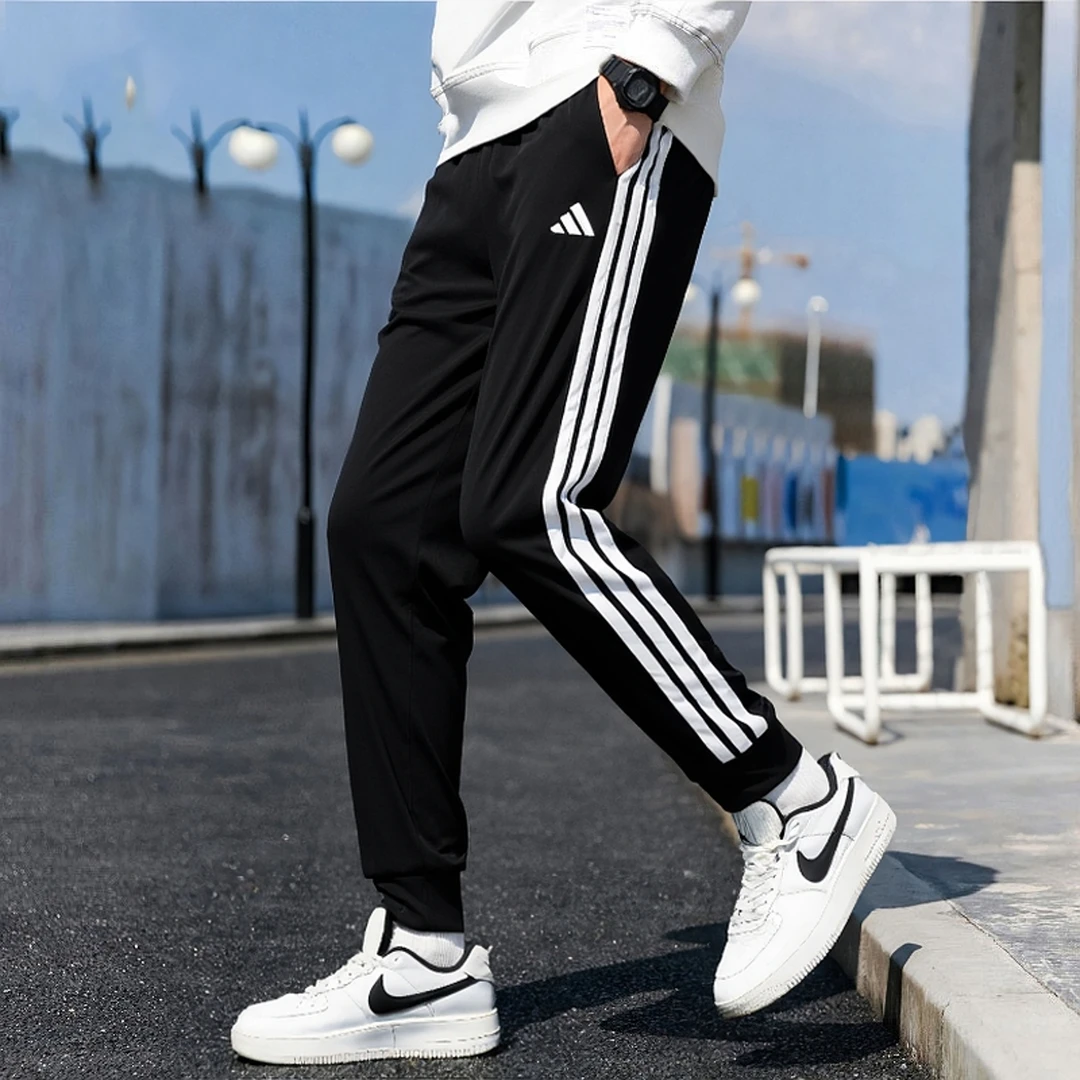 阿迪达斯长裤男裤秋季新款黑色运动裤三条杠束脚休闲裤子JI8809