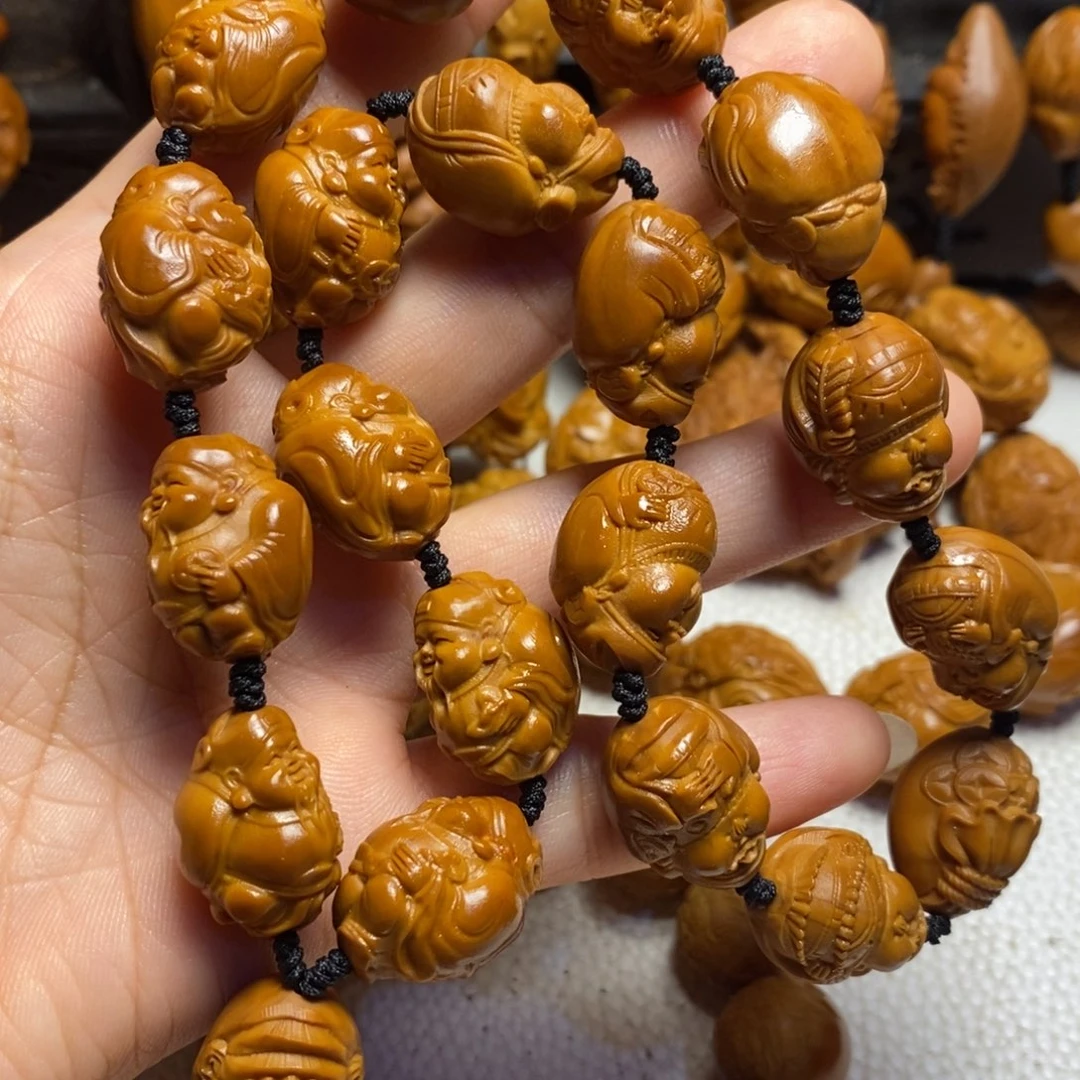 橄榄核吊坠财神手持