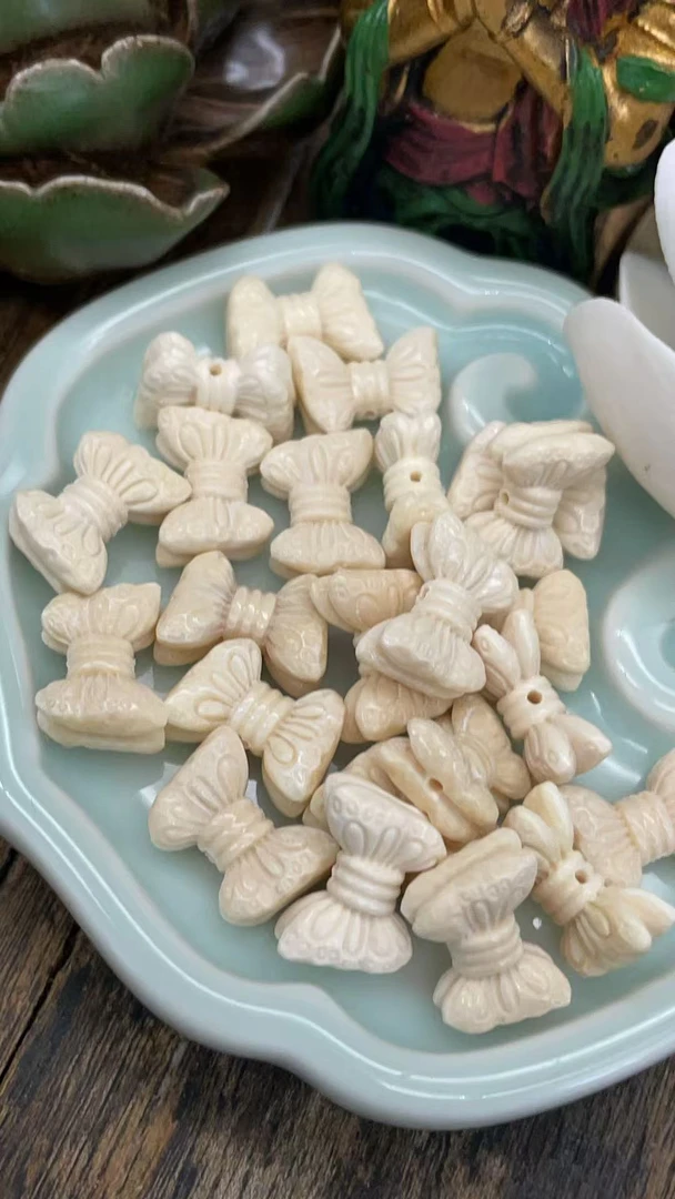 81010精猛犸象牙13.8*9.6左右文玩手串配珠顶珠蝴蝶结配饰（发其一