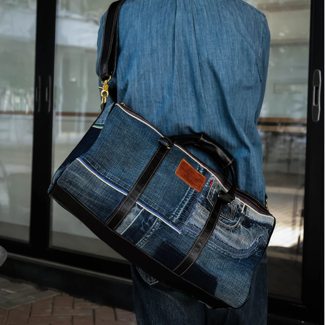 水洗赤耳牛仔裤裁剪拼接旅行包行李包