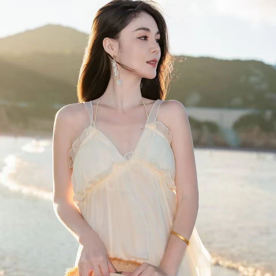 海边度假气质挂脖吊带连衣裙女夏季法式纯欲性感露背不规则长裙子