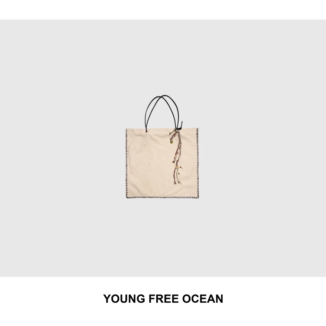 YOUNG FREE OCEAN2025春款 复古皮绳花辫布包V8088