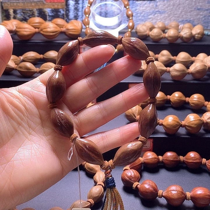 橄榄核手串三面佛紫皮14×27