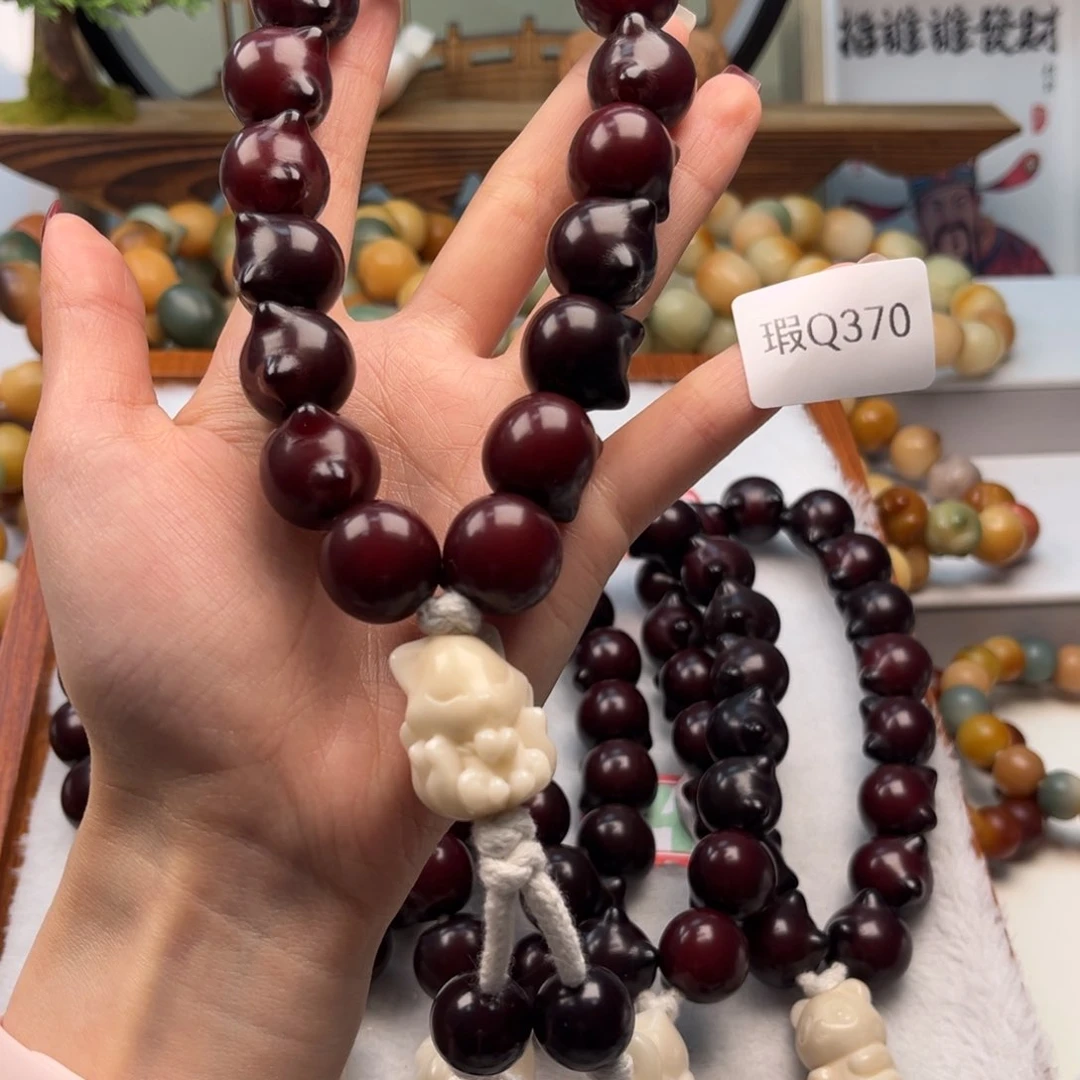 菩提根/象牙果手串说***币17mm瑕手持一串q370