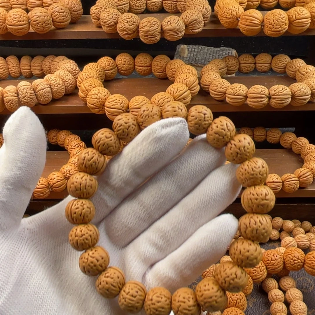 大***M吊坠桃核野生宽脐金豆